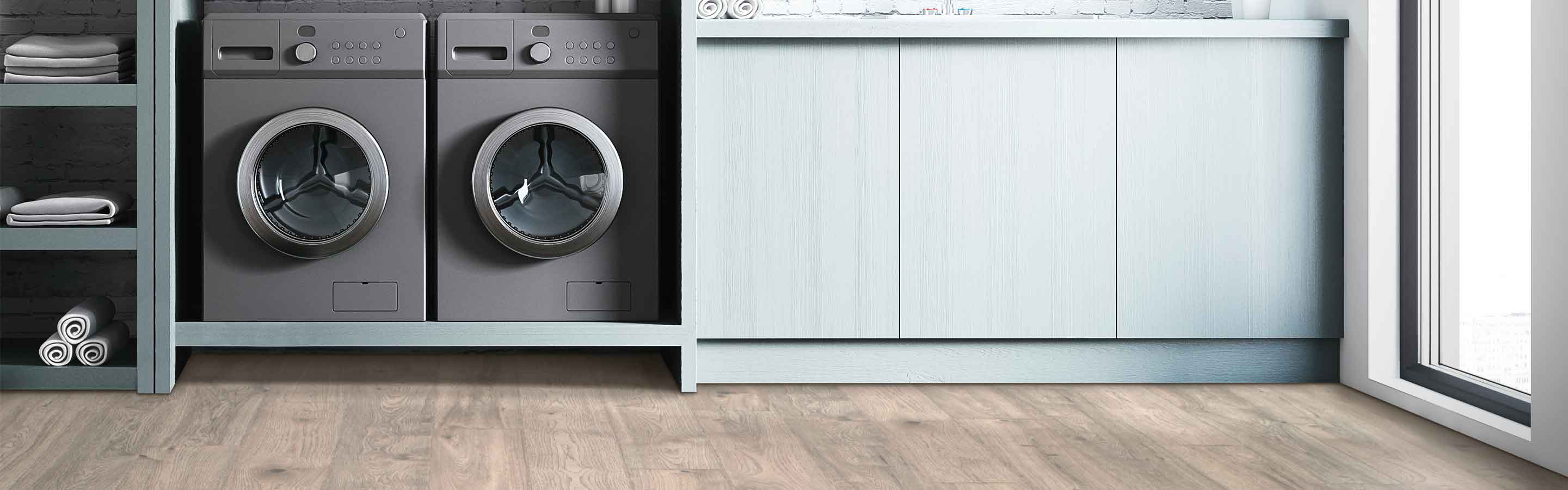 laminate wood look flooring in a laundry room with built in shelving