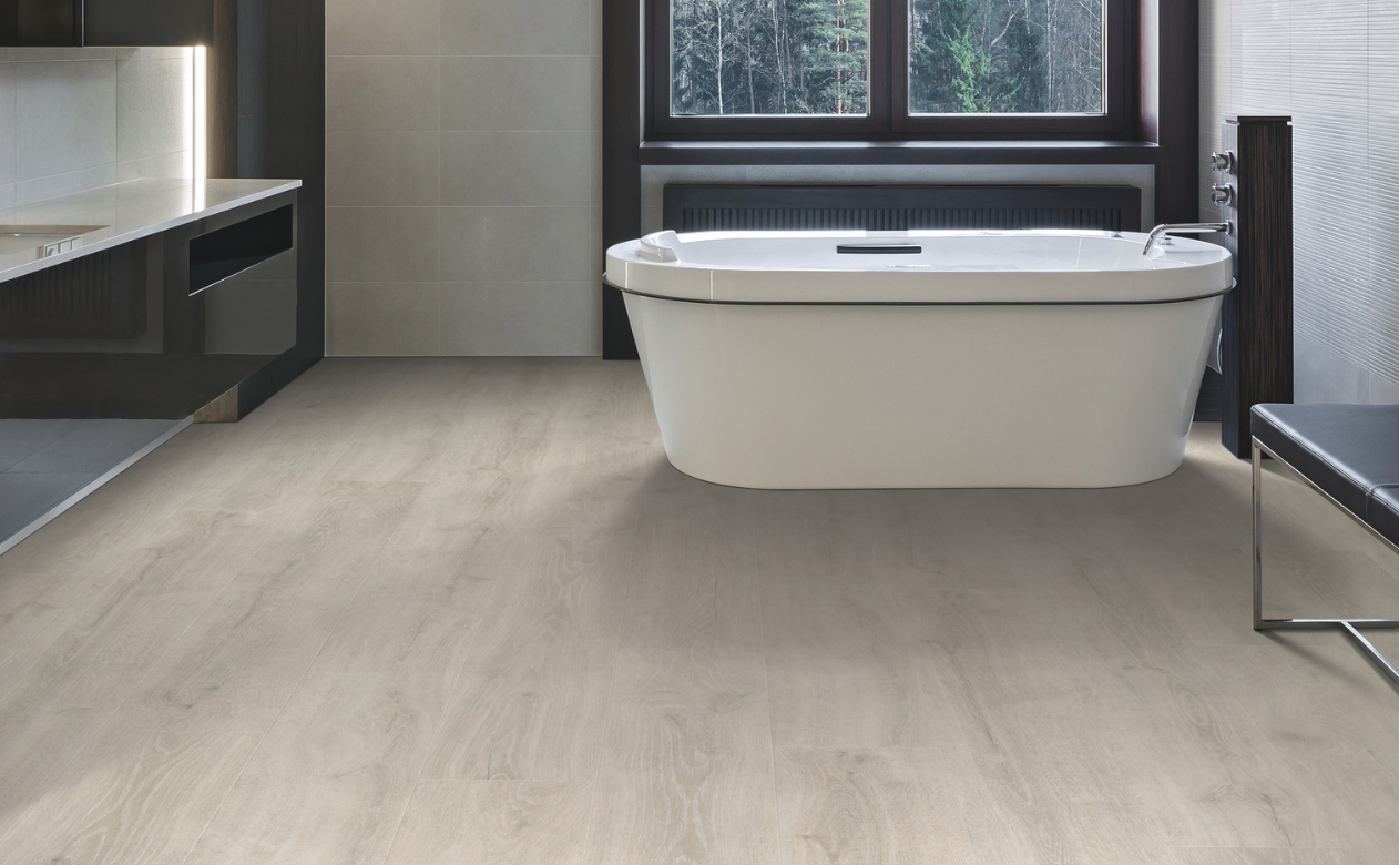 Bathroom with laminate flooring and standing bathtub
