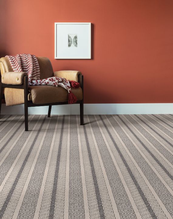 Striped carpet with orange wall